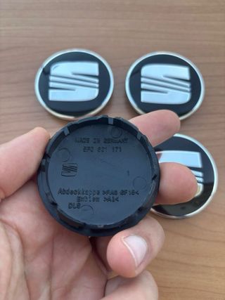 Tapabujes Seat 56mm negro plata nuevos
