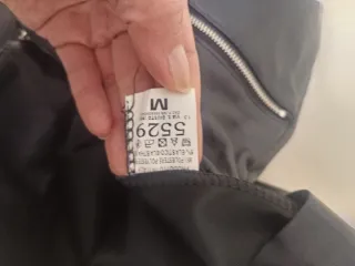 Pantaloni ecopelle neri con zip silver