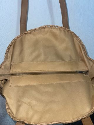 Bolso redondo de rafia con asas de piel