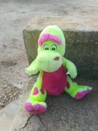Peluche dinosaurio verde y rosa