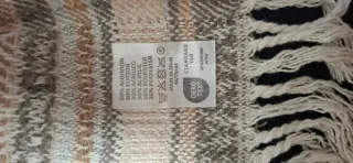 Manta decorativa con flecos