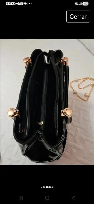 Bolso negro de mano y bandolera