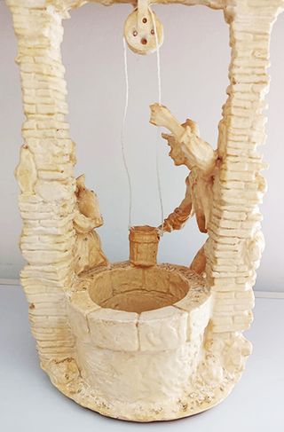 Statuetta uomo e donna al pozzo vintage  - anni 50