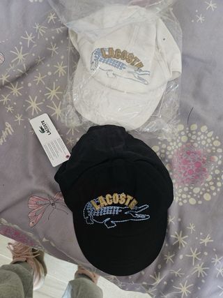 Gorra Lacoste Blanca y otra negra precio por unida