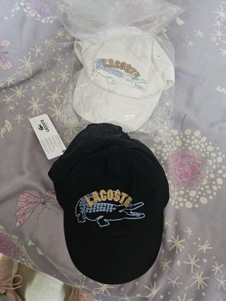 Gorra Lacoste Blanca y otra negra precio por unida
