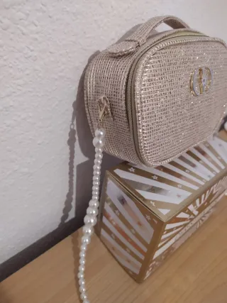 Neceser Dior dorado brillante