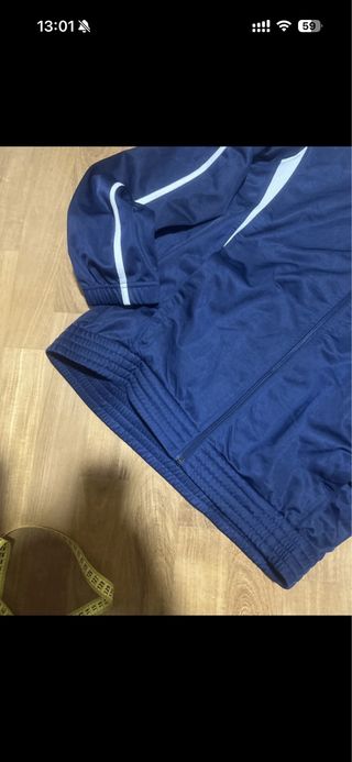 Giacca sportiva Asics blu e bianca