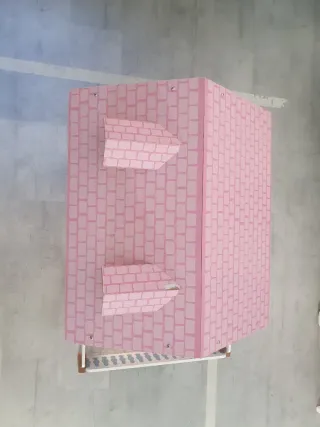 Casa de muñecas giratoria