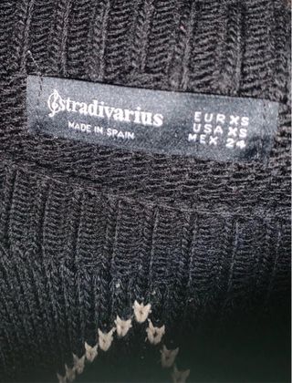 Camisola preta e bege com padrão argyle