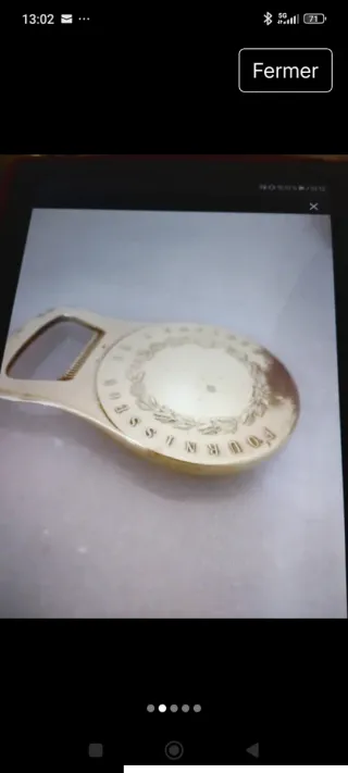 Abrebotellas con medalla Christophe