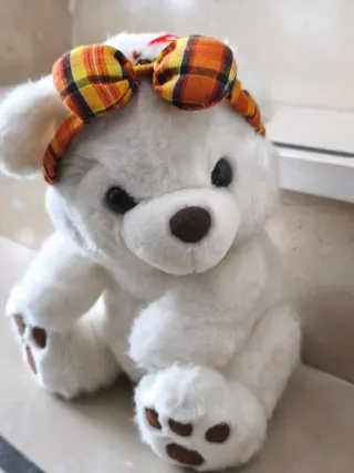 Orsacchiotto peluche bianco con fiocco