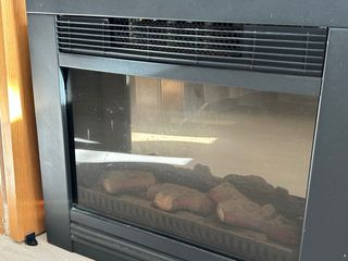 Estufa eléctrica de cristal y metal