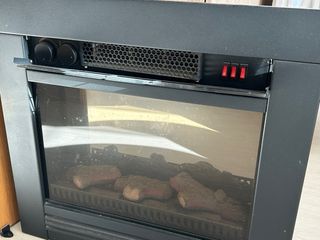 Estufa eléctrica de cristal y metal