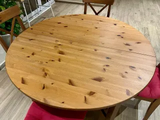 Mesa de comedor redonda de madera extensible
