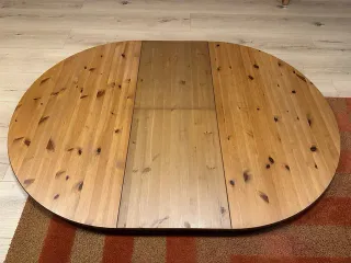 Mesa de comedor redonda de madera extensible