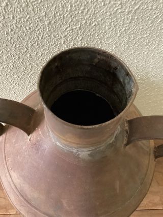 Lechera antigua de metal