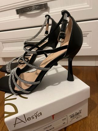 Tacchi con glitter neri e argento