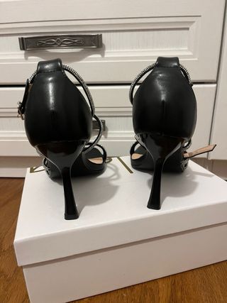 Tacchi con glitter neri e argento