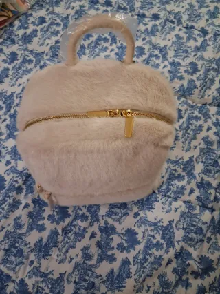 Zaino beige in pelliccia sintetica