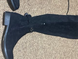 Botas altas negras con cordones y hebilla