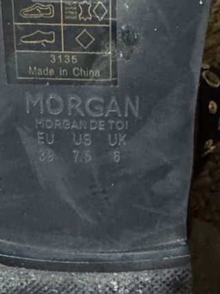 Botas altas negras con cordones y hebilla