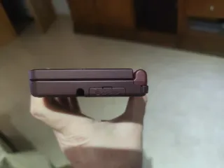 Nintendo DSi XL Burdeos. Con 14 juegos instalados.