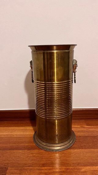 Paragüero de latón con diseño de cara de mujer