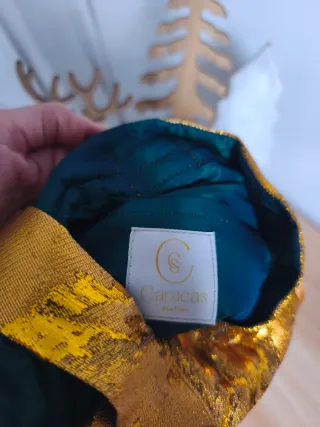 Bolso de mano dorado estilo atelier