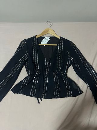 Blusa Subdued con detalles plateados