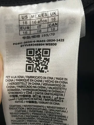 Pantalones Guess acampanados efecto piel