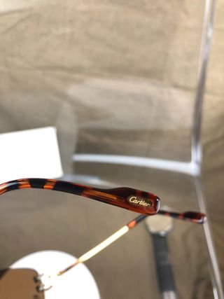 Gafas de sol Cartier doradas y marrones