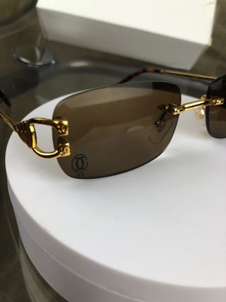 Gafas de sol Cartier doradas y marrones