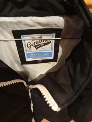 Cazadora de plumas negra hombre