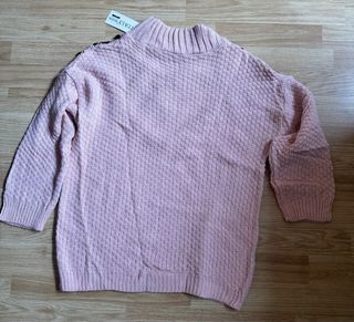 Jersey rosa con abalorios