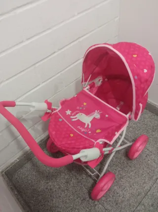 Carro de muñecas rosa con capota nuevo a estrenar
