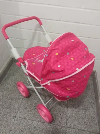 Carro de muñecas rosa con capota nuevo a estrenar