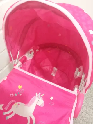 Carro de muñecas rosa con capota nuevo a estrenar
