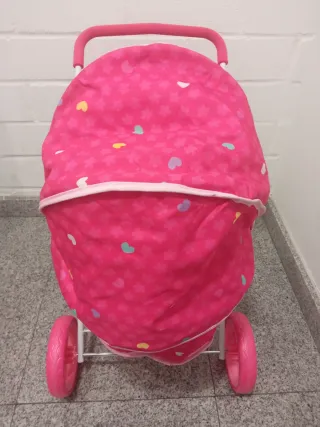 Carro de muñecas rosa con capota nuevo a estrenar