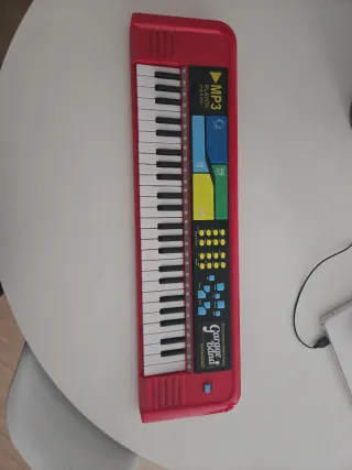 Teclado de juguete rojo MP3 y Garaje Band