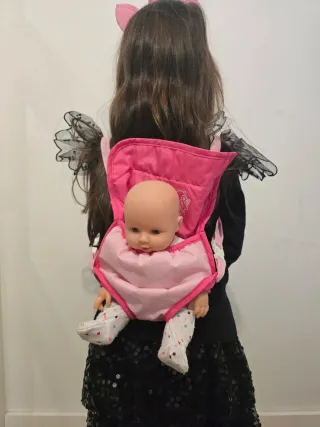 Muñeca bebé con accesorios de paseo