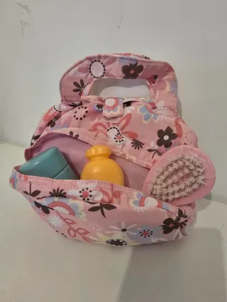 Muñeca bebé con accesorios de cambio de pañal