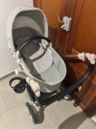 Passeggino per neonati grigio e dorato