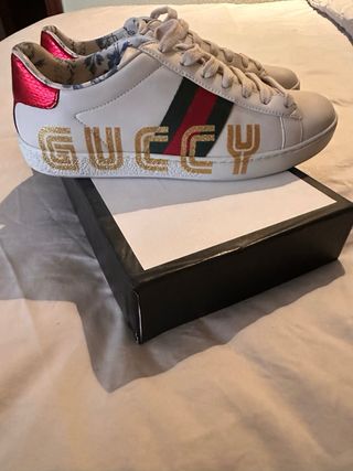 Sneakers Gucci bianche e dorate in pelle crema