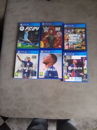 PS4 (PlayStation 4) con 2 mandos y 6 juegos