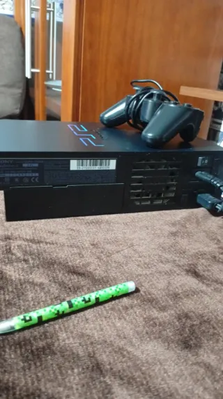 Consola PlayStation 2 con juegos