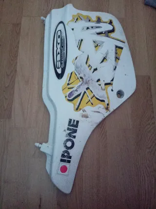 Tapa lateral Suzuki R M X 50