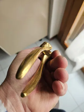 Schiaccianoci ottone lucido teste leone