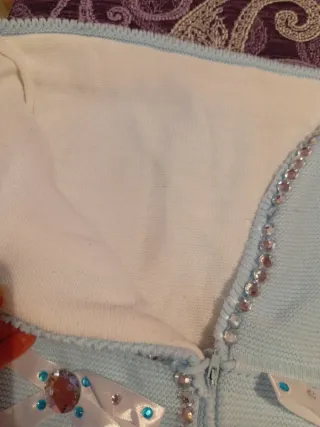 Saco de bebé azul con adornos