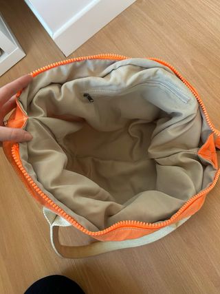 Borsa arancione con stampa rondini dorate