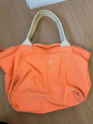 Borsa arancione con stampa rondini dorate